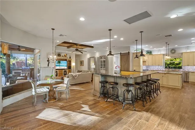 a large dining space with lots of furniture and view living room