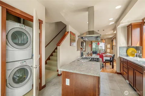 a view of a kitchen and utility room