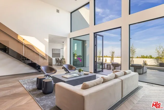 a living room with furniture rug and window