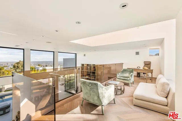 a room with furniture and a large window