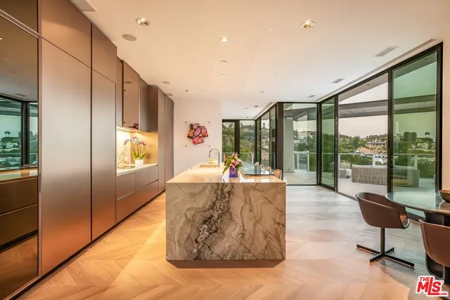 a bathroom with a double vanity sink a mirror and a bathtub