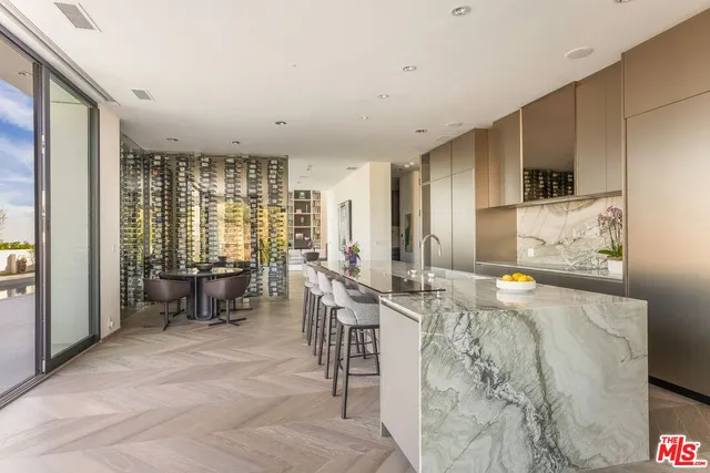 a view of a balcony with table and chairs