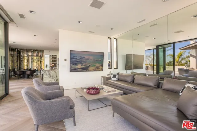 a building outdoor space with patio furniture and potted plants