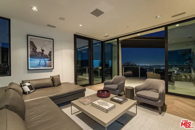 a view of a patio with couches and potted plants