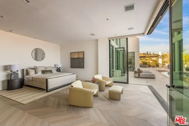 a view of a balcony with chair and wooden floor