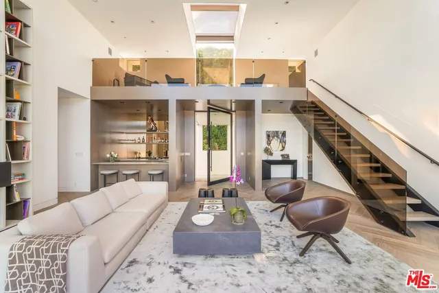 a kitchen with granite countertop a refrigerator and a sink