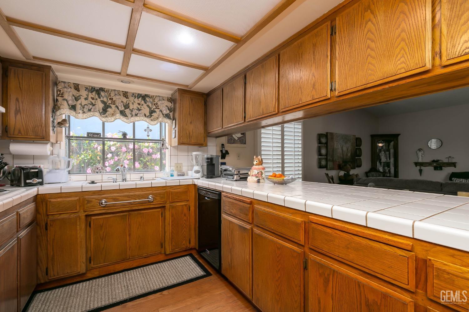 Undisclosed Address Bakersfield, CA 93312 - Photo 17 of 27 a kitchen with sink cabinets and window