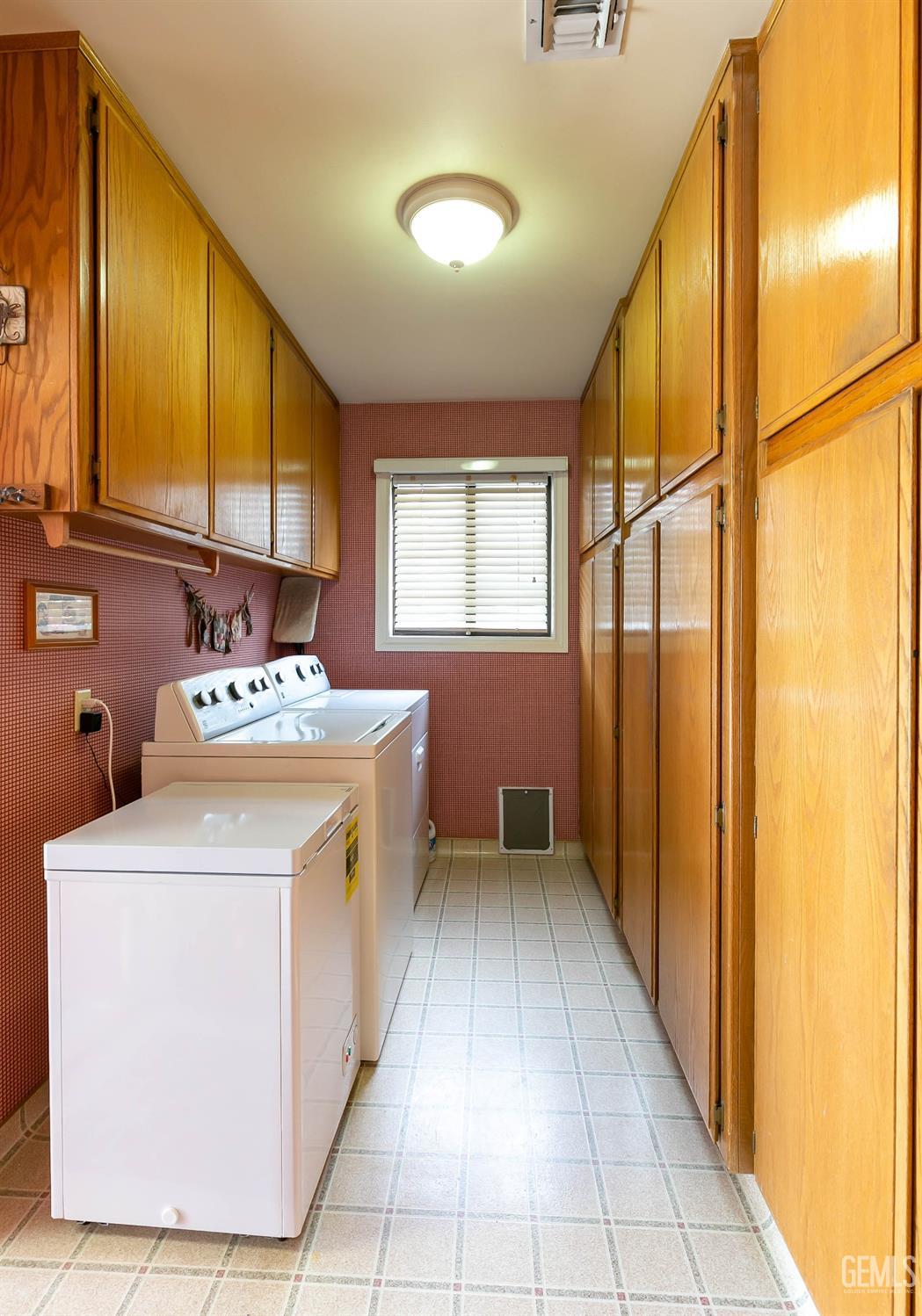 Undisclosed Address Bakersfield, CA 93312 - Photo 20 of 27 a utility room with a sink a washer and dryer