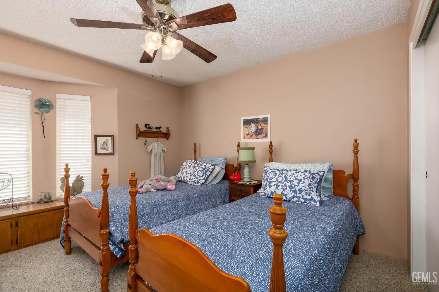 Undisclosed Address Bakersfield, CA 93312 - Photo 26 of 27 a bedroom with furniture and a bed