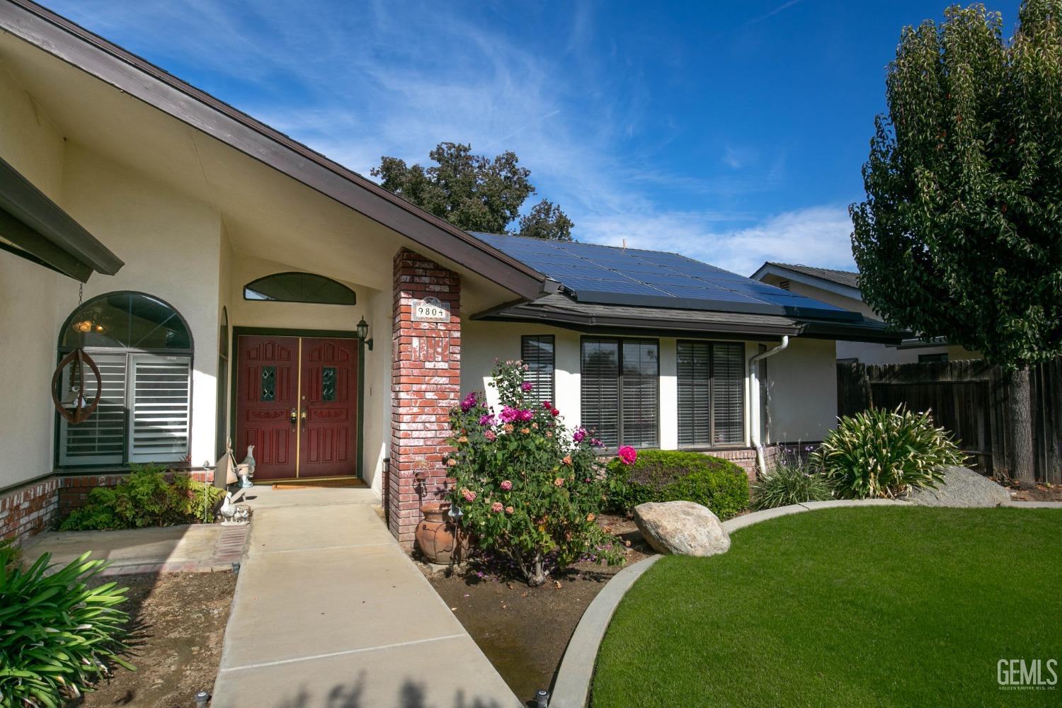 Undisclosed Address Bakersfield, CA 93312 - Photo 4 of 27 a front view of a house with garden