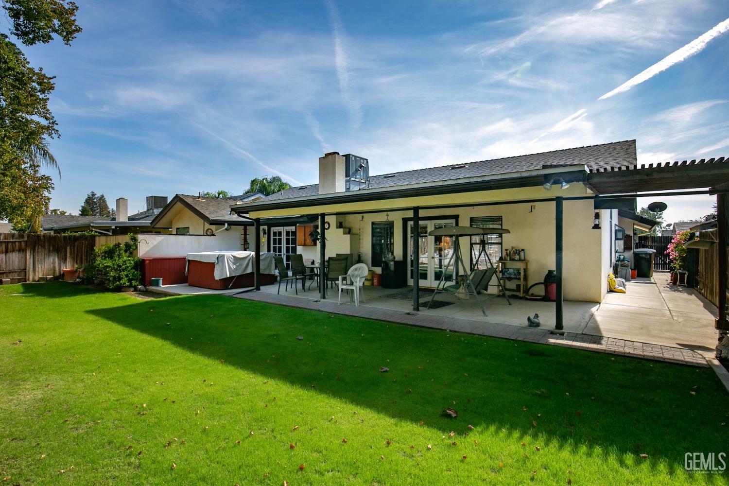 Undisclosed Address Bakersfield, CA 93312 - Photo 5 of 27 a view of an house with backyard porch and sitting area