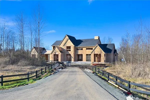 a front view of a house with yard