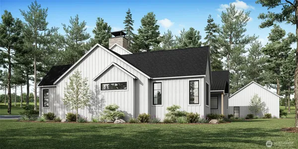 a view of a house with yard and a garden