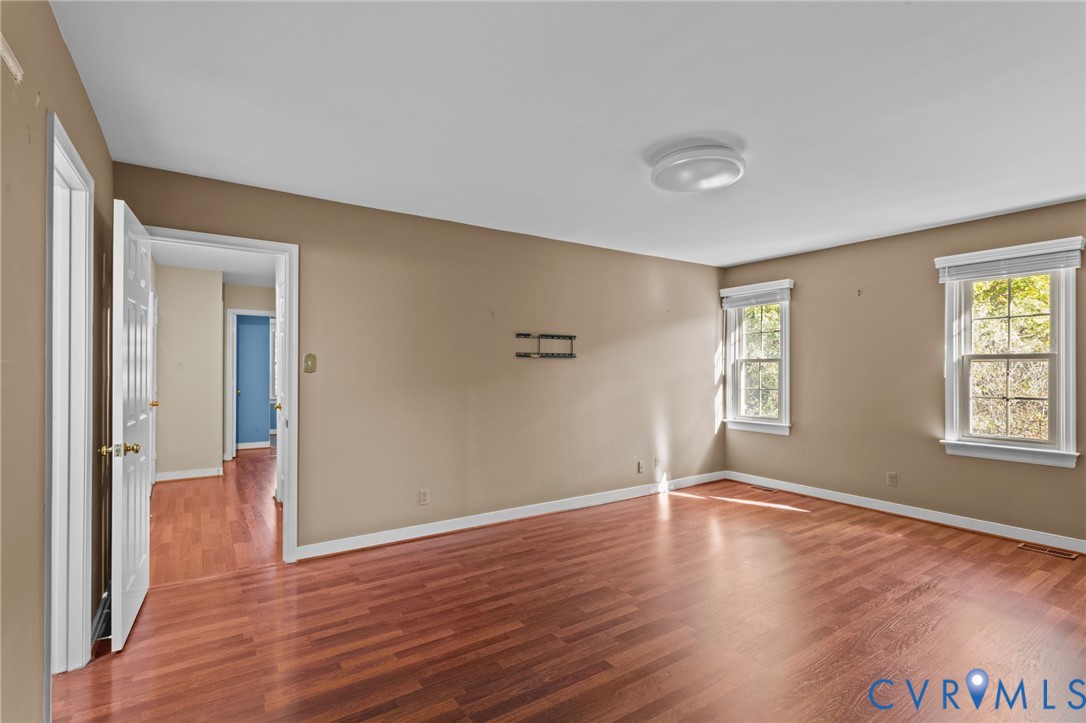 4717 Cedar Cliff Road Chester, VA 23831 - Photo 14 of 46 a view of an empty room with wooden floor and a window