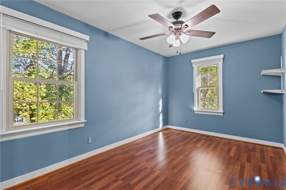 4717 Cedar Cliff Road Chester, VA 23831 - Photo 23 of 46 a view of an empty room with wooden floor and a window