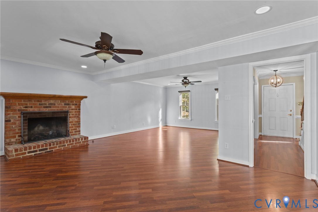 4717 Cedar Cliff Road Chester, VA 23831 - Photo 5 of 46 a view of empty room with wooden floor and a fireplace