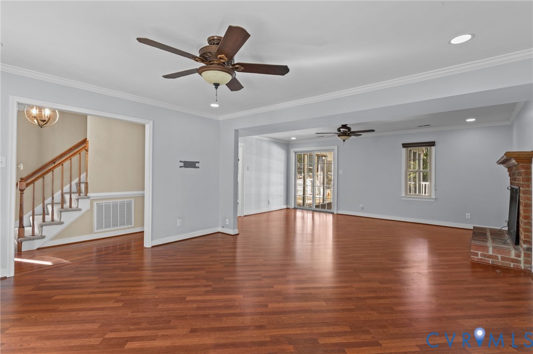 4717 Cedar Cliff Road Chester, VA 23831 - Photo 6 of 46 a view of an empty room with a window and wooden floor