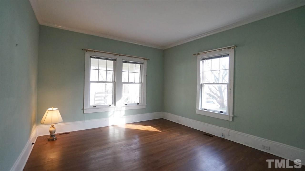 2251 The Circle Raleigh, NC 27608 - Photo 13 of 29 First Floor Master Bedroom has Double Window Exposure