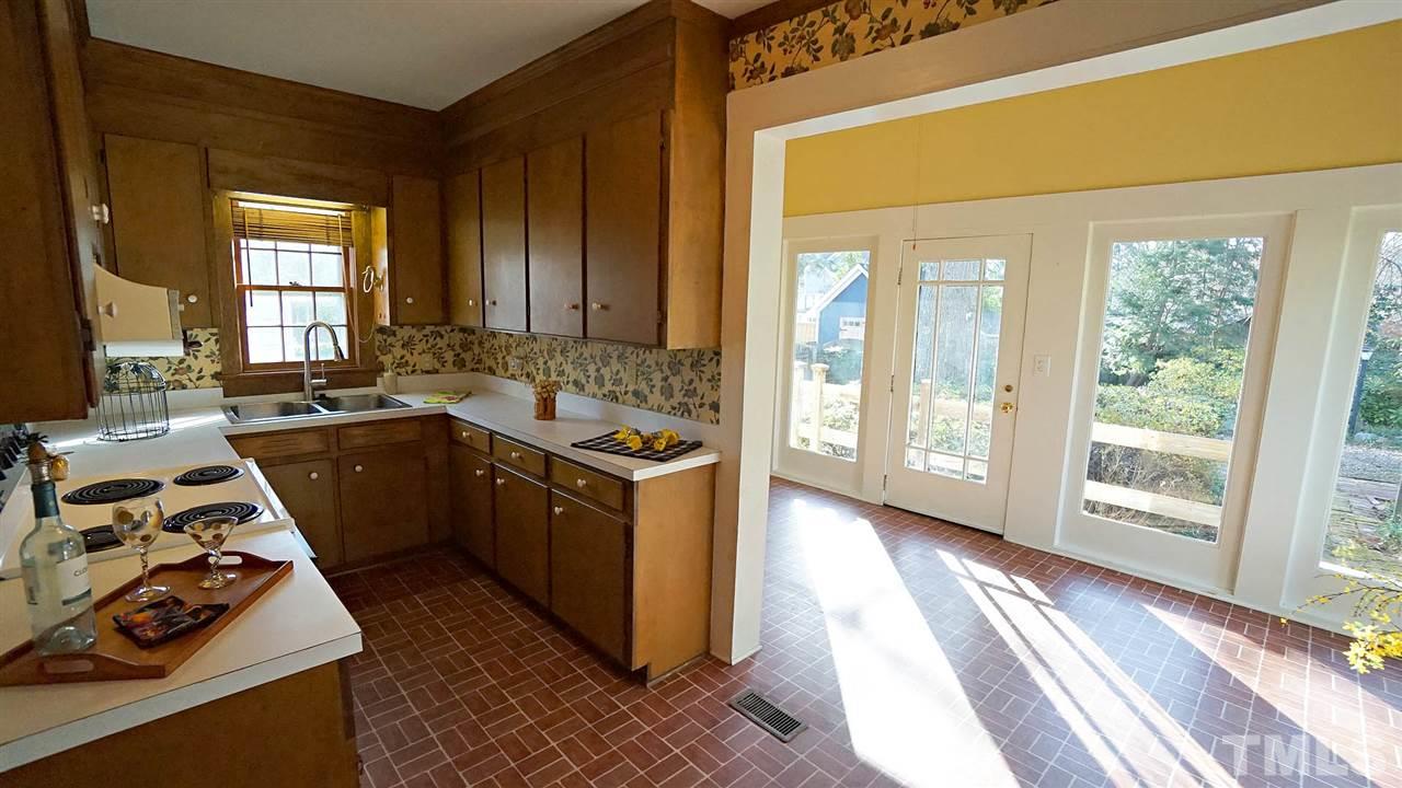 2251 The Circle Raleigh, NC 27608 - Photo 18 of 29 Kitchen is adjacent to Sun Room