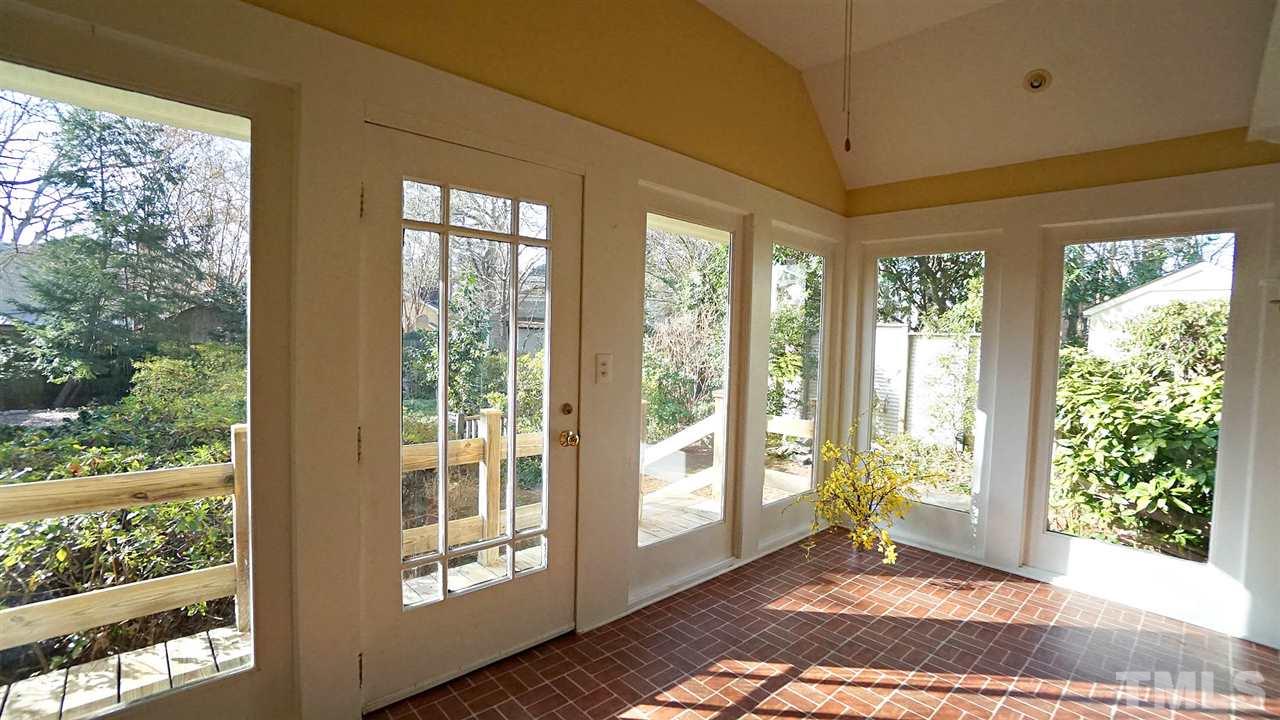 2251 The Circle Raleigh, NC 27608 - Photo 19 of 29 Sunroom offers a Great Space to Enjoy Life and overlook the Private Backyard.