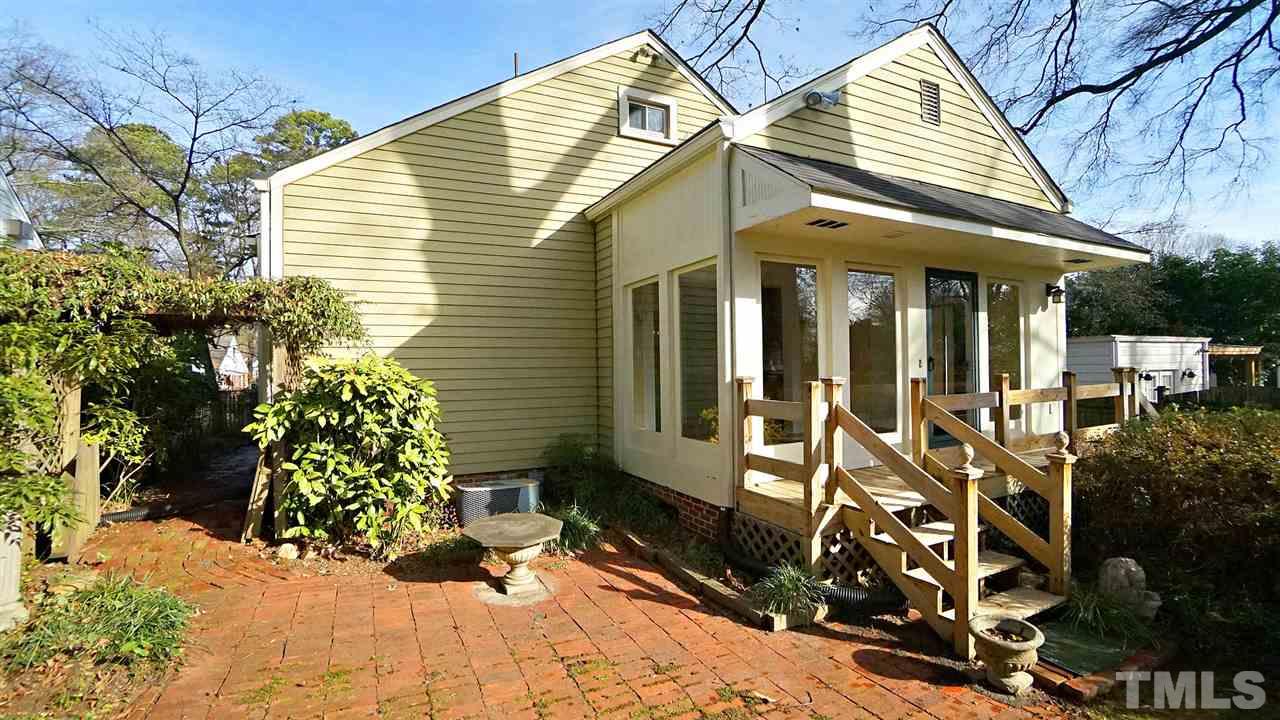 2251 The Circle Raleigh, NC 27608 - Photo 29 of 29 Back view of Home showcasing the Sunroom
