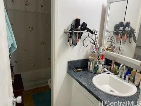 a bathroom with a sink and mirror
