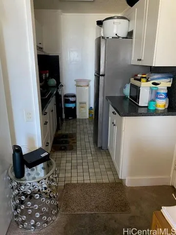 a kitchen with a sink appliances and cabinets