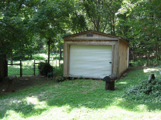 365 Double Branch Road Dickson, TN 37055 - Photo 11 of 20 a front view of a house with garden