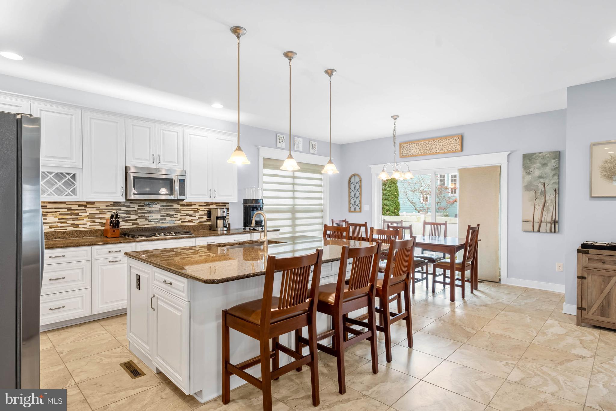 507 Jones Lane Rehoboth Beach, DE 19971 - Photo 12 of 62 a kitchen with appliances a sink a counter top space and cabinets