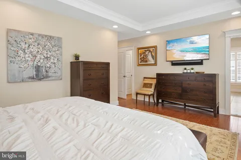a spacious bathroom with a granite countertop sink a mirror and a shower
