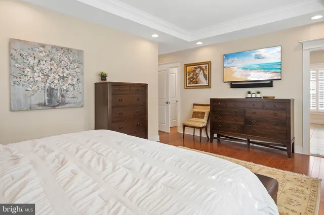 a spacious bathroom with a granite countertop sink a mirror and a shower