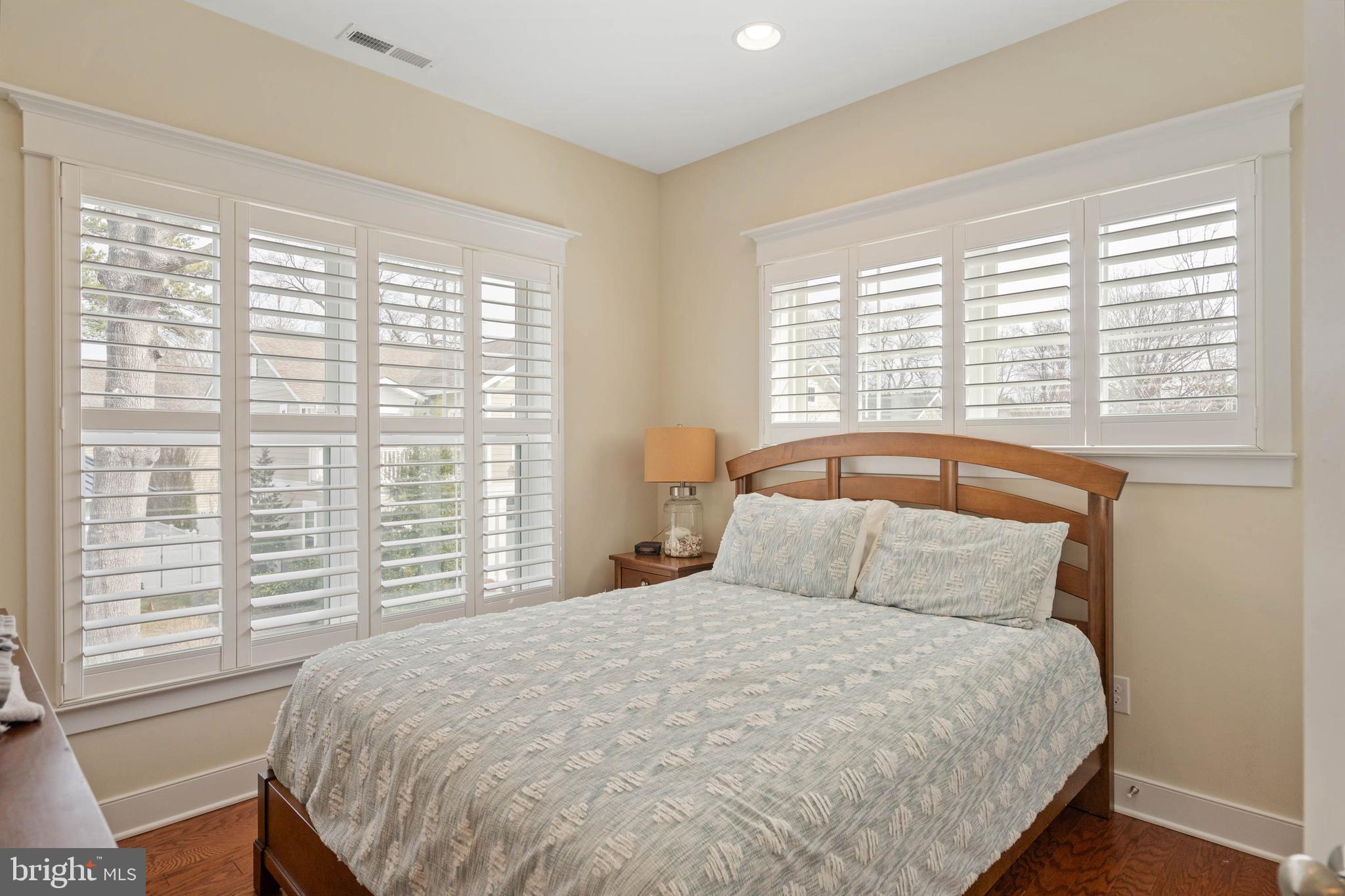 507 Jones Lane Rehoboth Beach, DE 19971 - Photo 41 of 62 a bedroom with a large bed and a large window