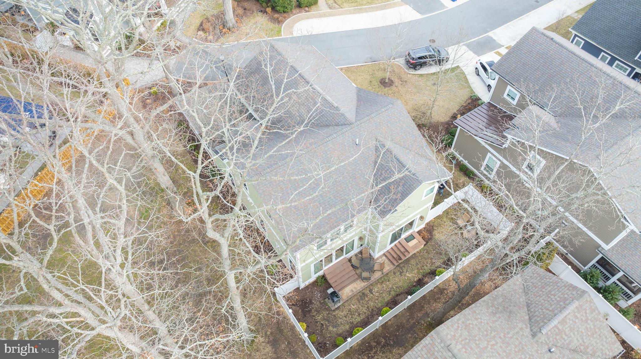 507 Jones Lane Rehoboth Beach, DE 19971 - Photo 50 of 62 a bed with a white comforter and pillows