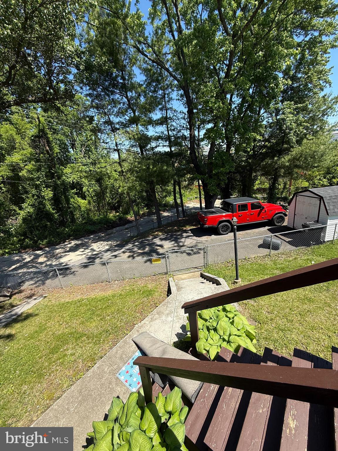 2235 Hawthorne Road Baltimore, MD 21220 - Photo 32 of 35 a view of a wooden deck with chairs and a yard