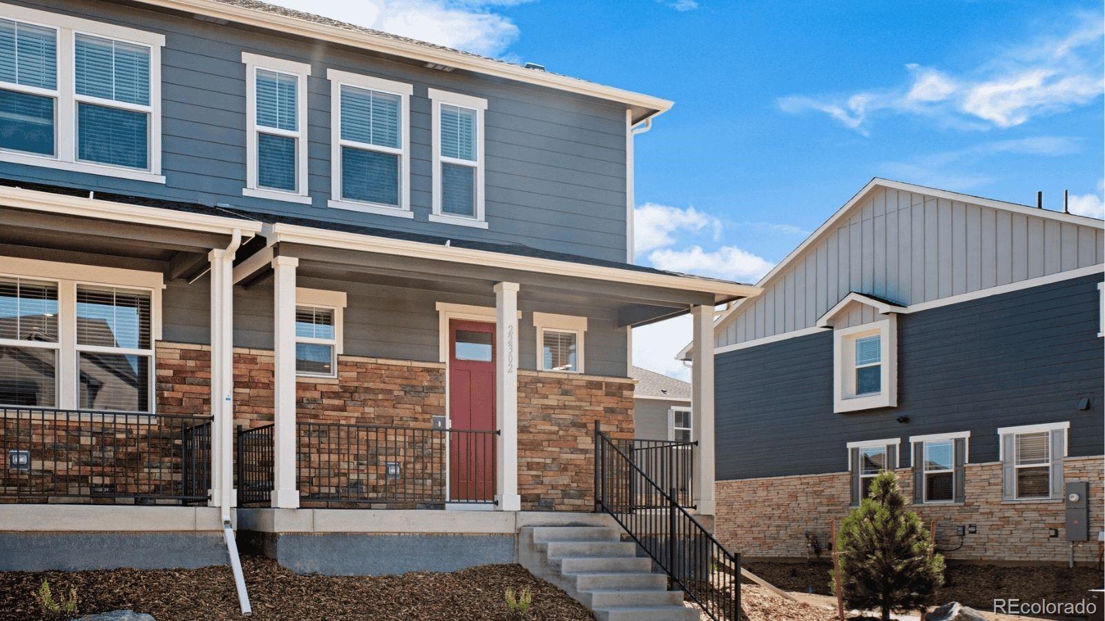 1358 South Chester Street, Unit B Denver, CO 80247 - Photo 1 of 42 a front view of a house with glass windows