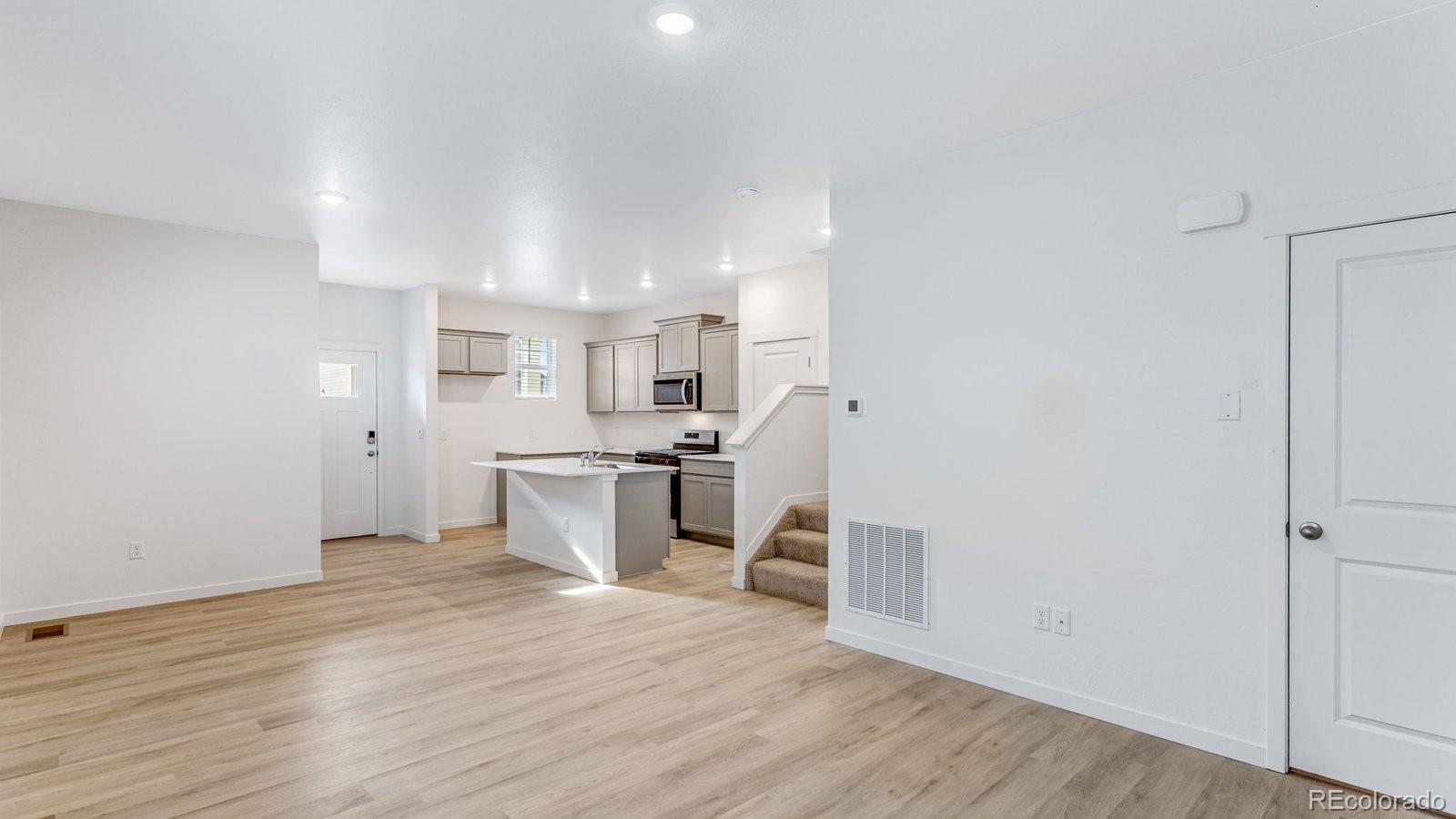 1358 South Chester Street, Unit B Denver, CO 80247 - Photo 14 of 42 a view of kitchen with wooden floor