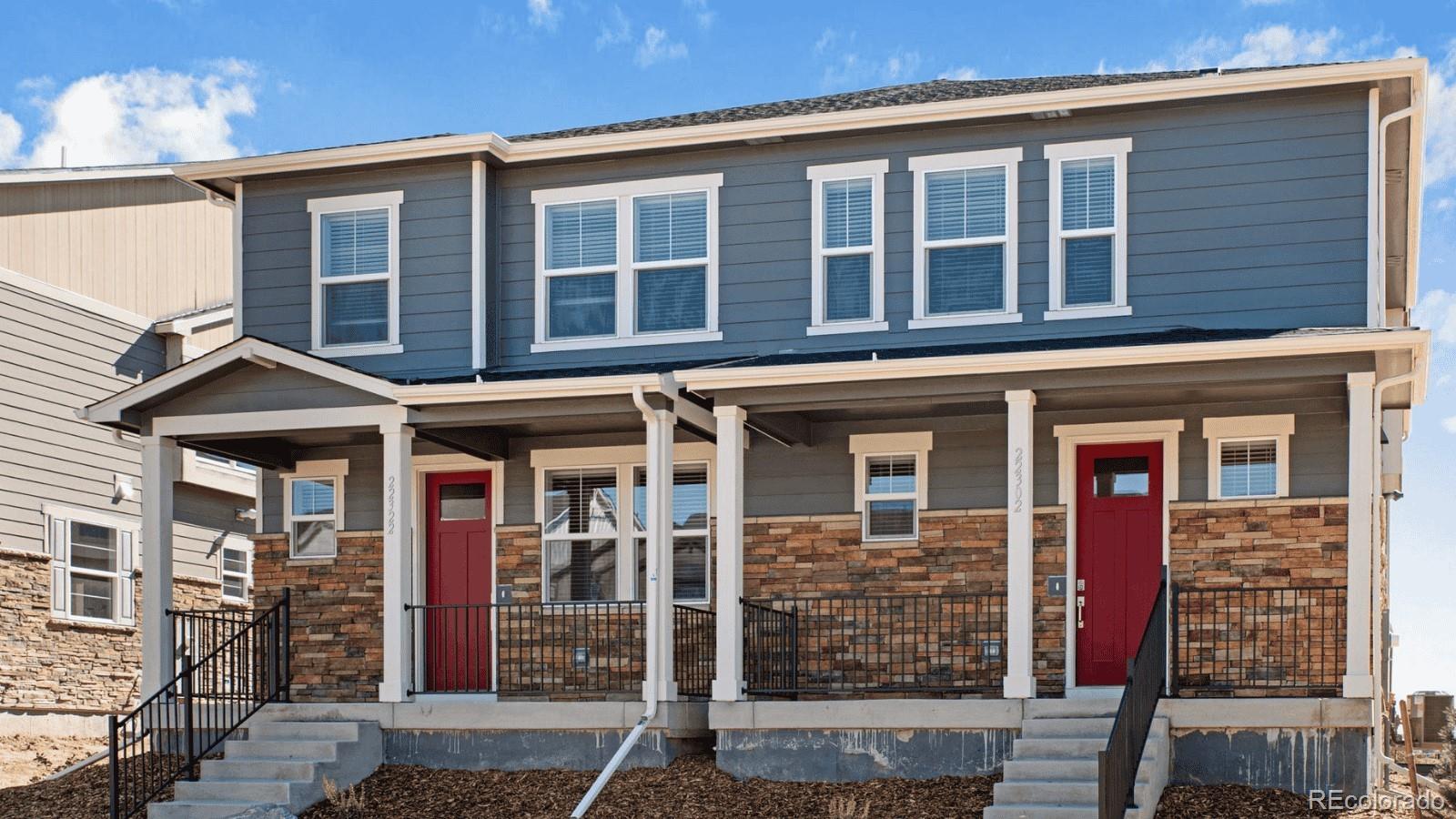 1358 South Chester Street, Unit B Denver, CO 80247 - Photo 2 of 42 front view of a house