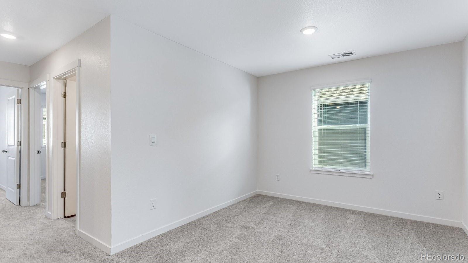 1358 South Chester Street, Unit B Denver, CO 80247 - Photo 27 of 42 an empty room with a window