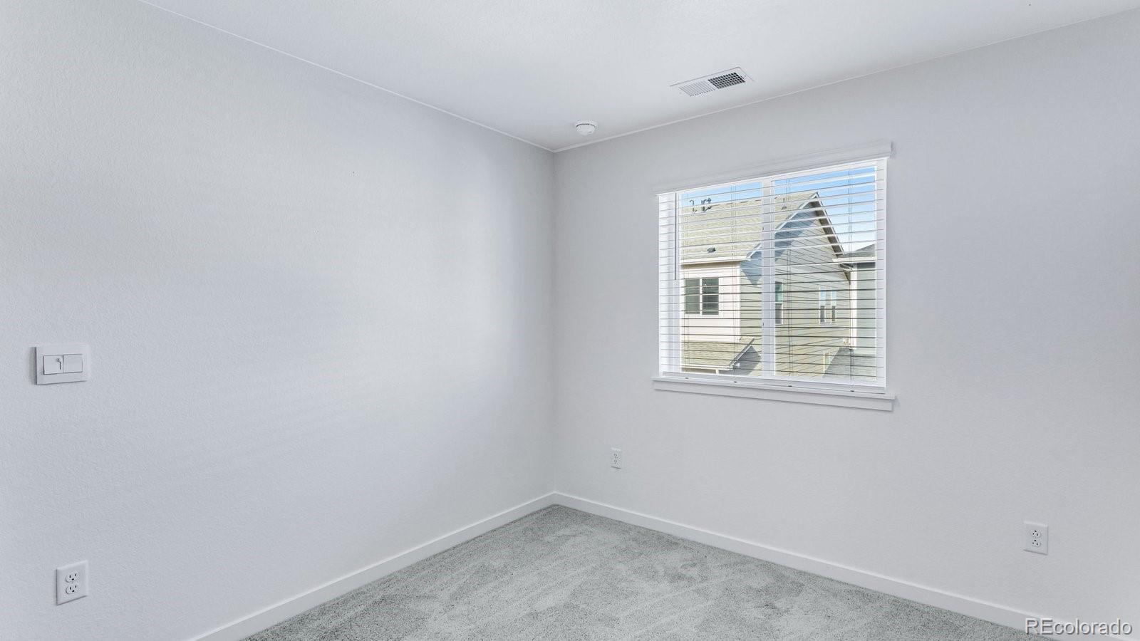 1358 South Chester Street, Unit B Denver, CO 80247 - Photo 31 of 42 an empty room with a window