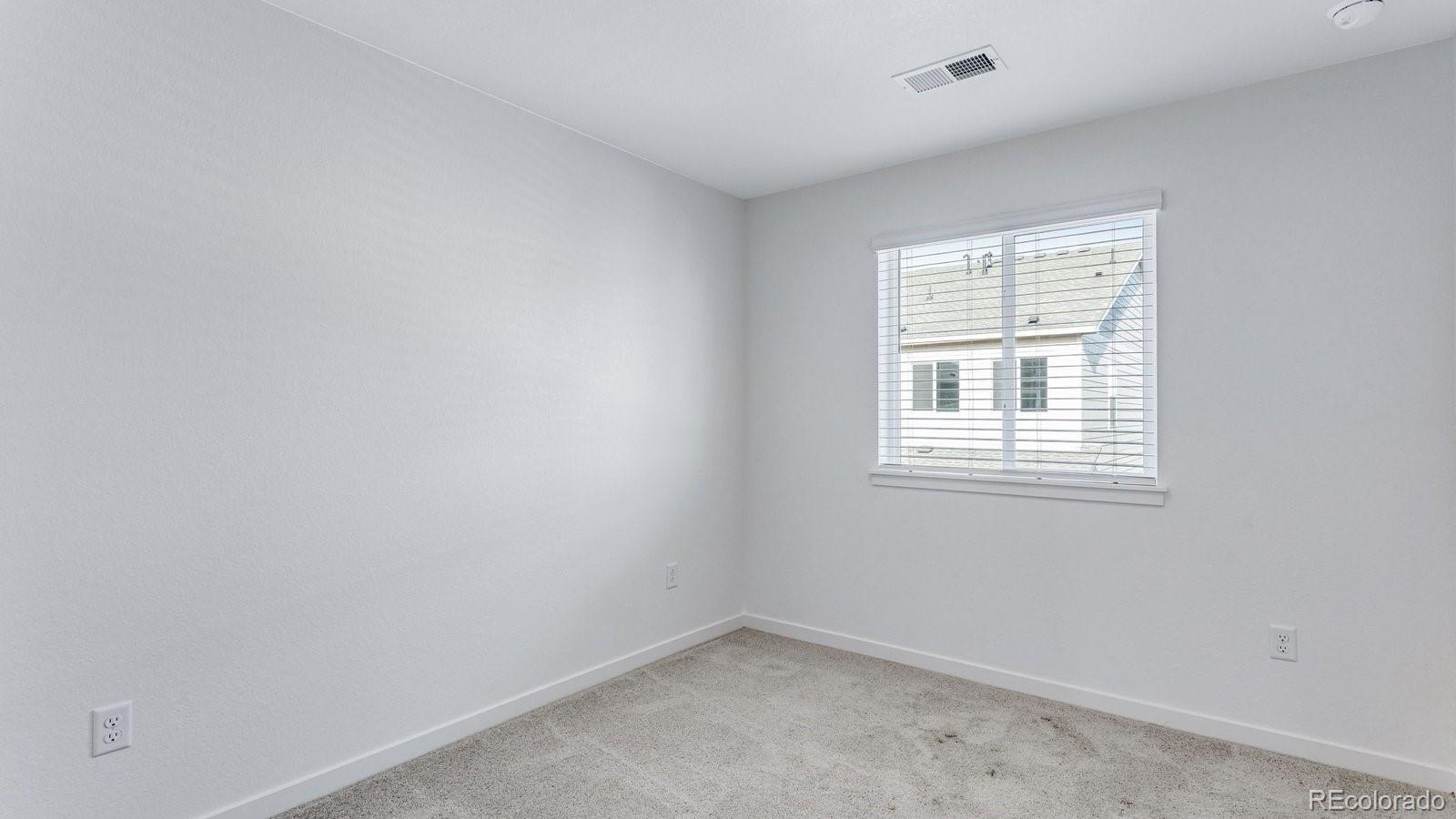 1358 South Chester Street, Unit B Denver, CO 80247 - Photo 34 of 42 an empty room with a window