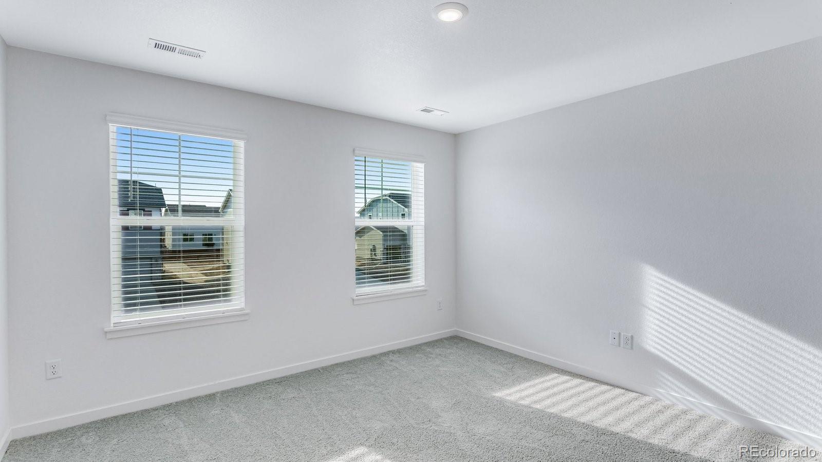 1358 South Chester Street, Unit B Denver, CO 80247 - Photo 39 of 42 a view of an empty room with a window