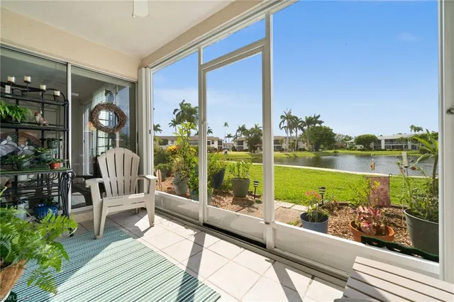 a view of a chair and tables in the balcony