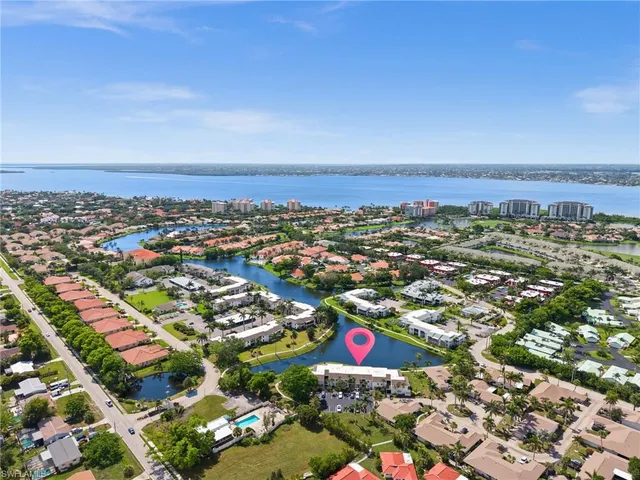 an aerial view of city and lake