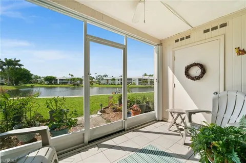 a view of a balcony with chair and table