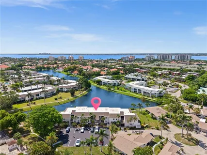 a view of a yard with wooden fence