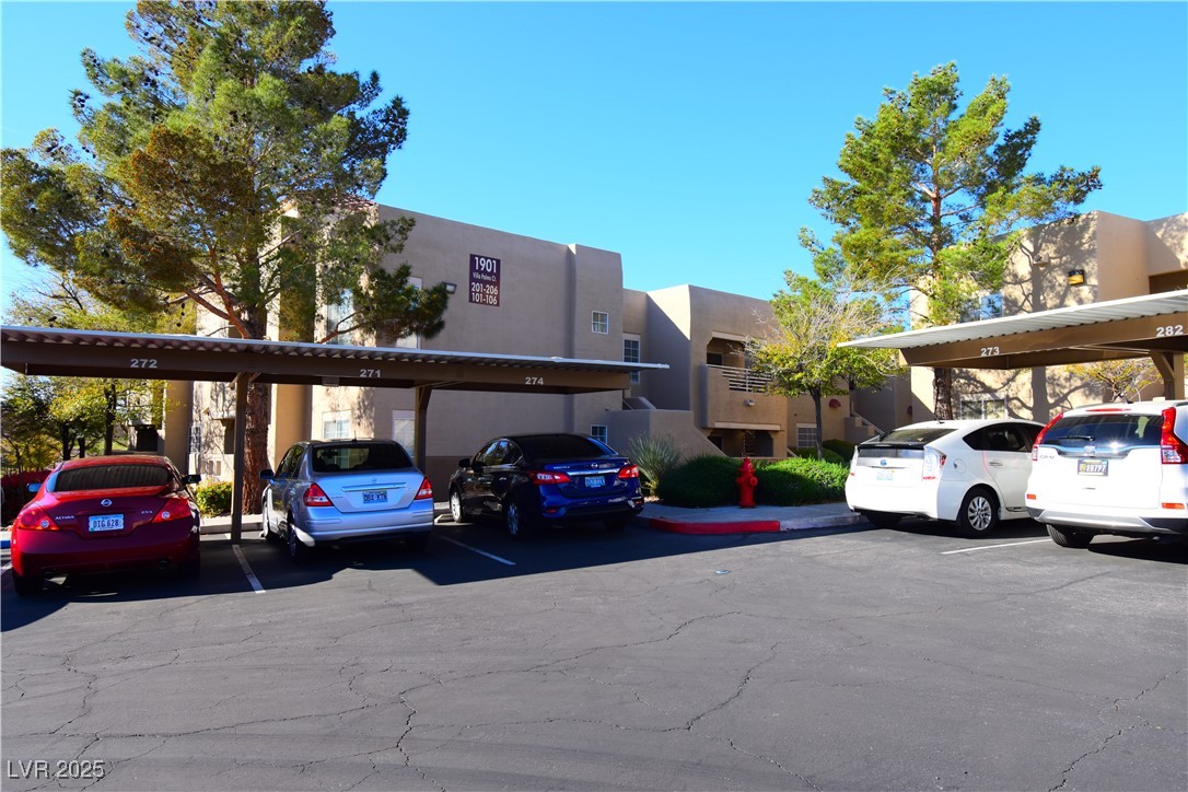 1901 Villa Palms Court, Unit 101 Las Vegas, NV 89128 - Photo 18 of 19 View of covered parking lot
