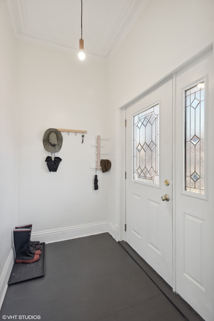 3238 South Green Street Chicago, IL 60608 - Photo 3 of 15 a view of an empty room with wooden floor and windows