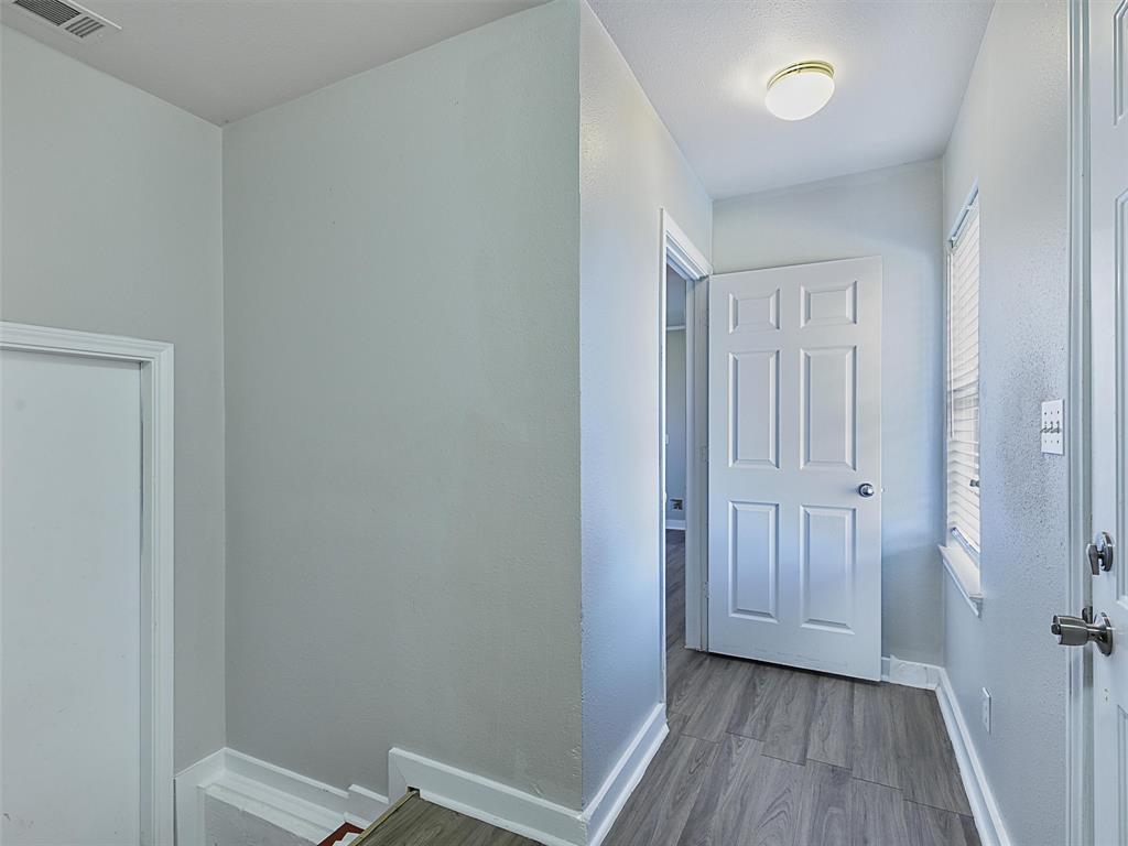 707 Doris Lane Gunter, TX 75058 - Photo 15 of 25 a view of a hallway with wooden floor