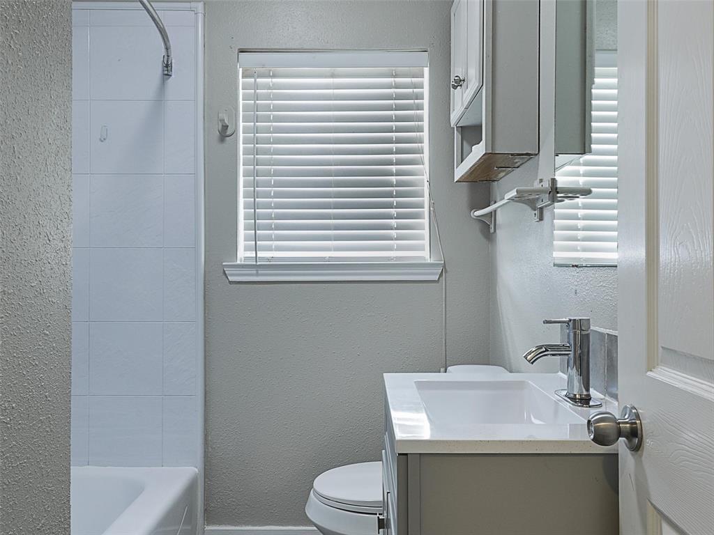 707 Doris Lane Gunter, TX 75058 - Photo 19 of 25 a bathroom with a sink toilet and tub