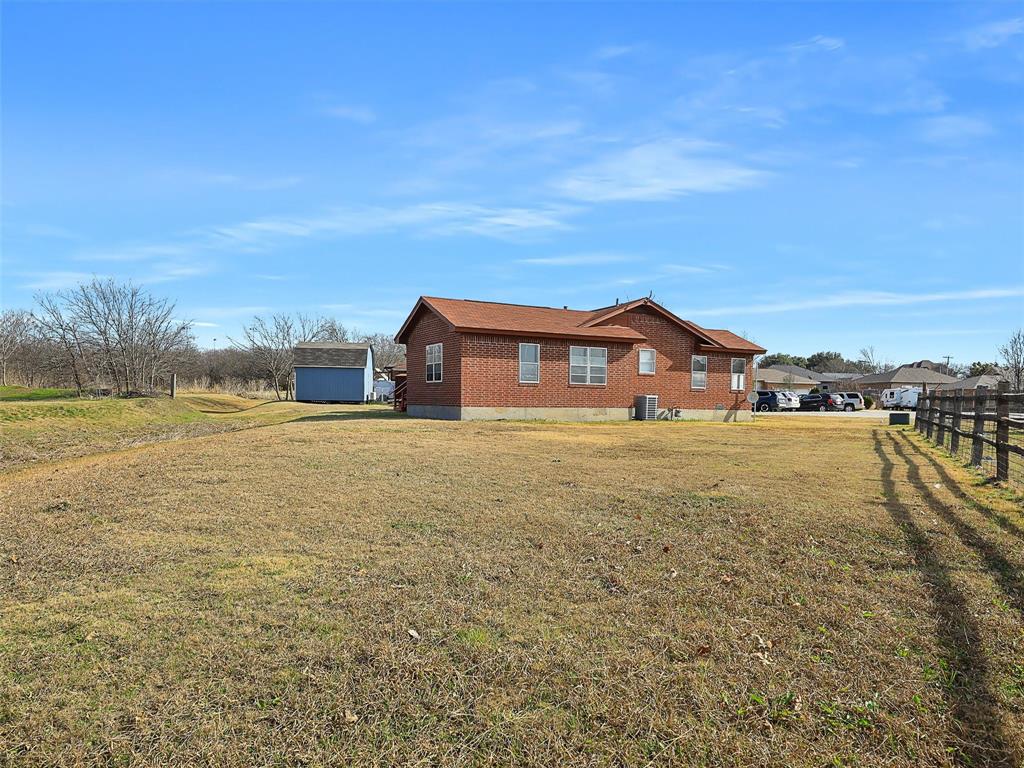707 Doris Lane Gunter, TX 75058 - Photo 23 of 25 a house view with a lake view
